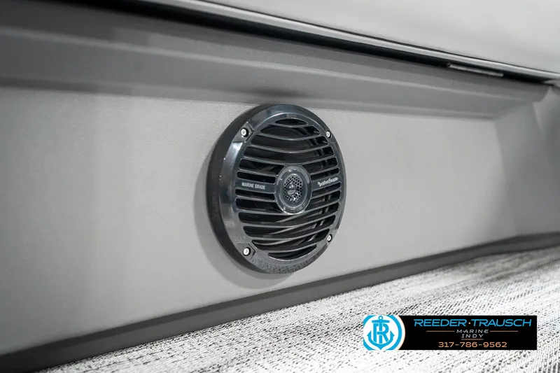 Slide: The Image of 2025 Bennington 21 SS boat speaker detail with Reeder-Trausch logo. - 47