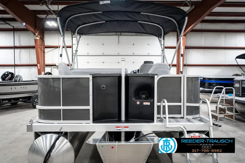 Slide: The Image of 2025 Bennington 21 SS pontoon boat in showroom, featuring sleek design and modern amenities. - 9