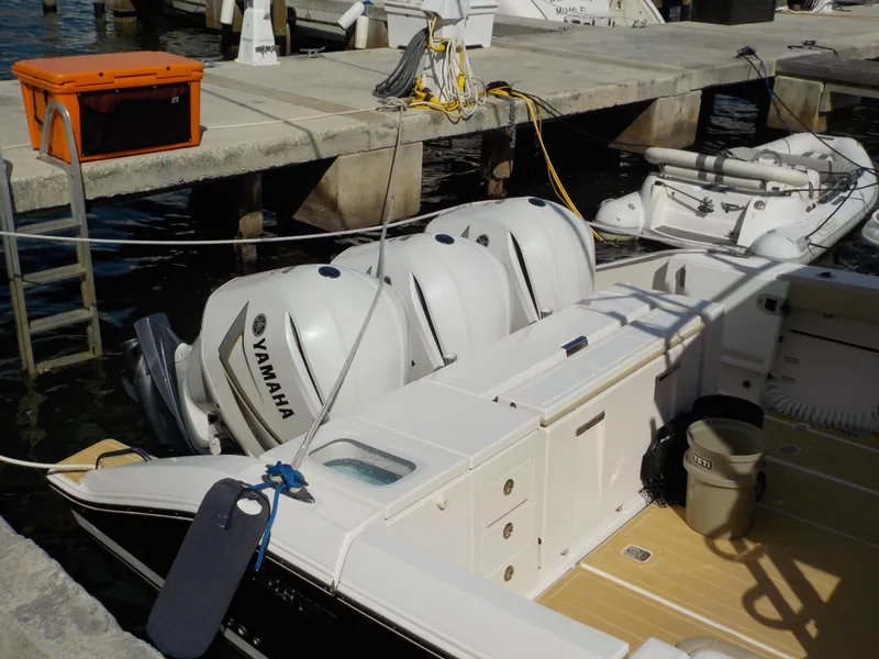 Slide: The Image of 2019 Pursuit S 368 boat docked with Yamaha outboard engines. - 5