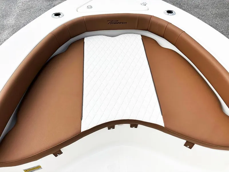 Slide: The Image of 2025 Pioneer 180 Islander boat with brown and white cushioned seating. - 13