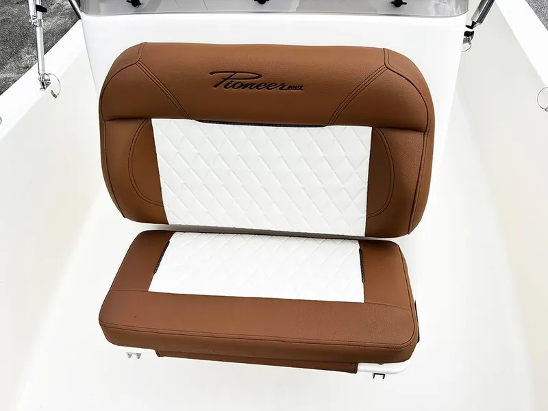 Slide: The Image of Brown and white seat of 2025 Pioneer 180 Islander boat. - 16