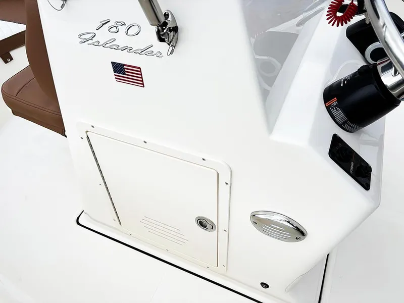 Slide: The Image of 2025 Pioneer 180 Islander boat console with American flag decal. - 17