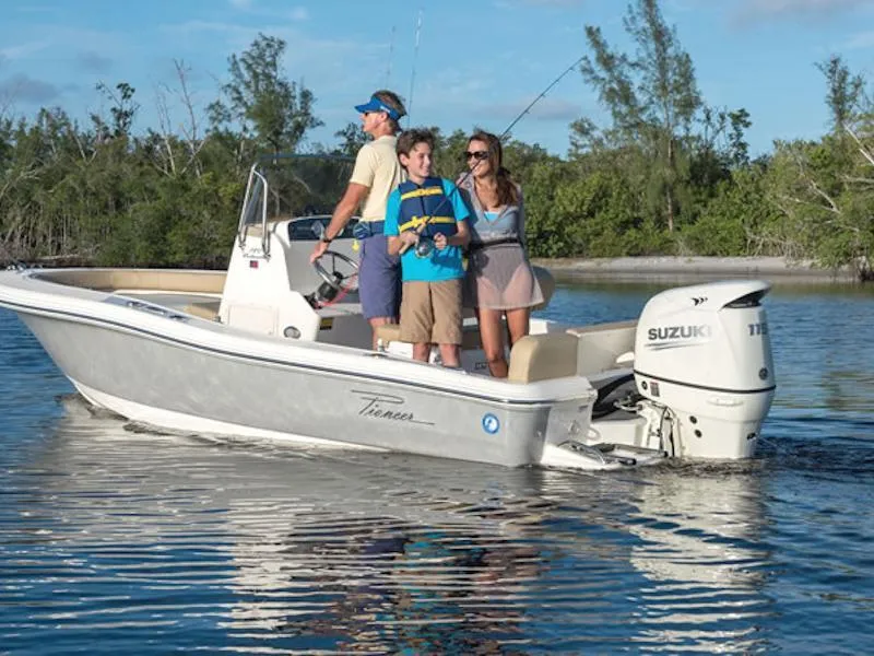 Slide: The Image of Family fishing on a 2025 Pioneer 180 Islander boat with Suzuki engine in calm waters. - 26