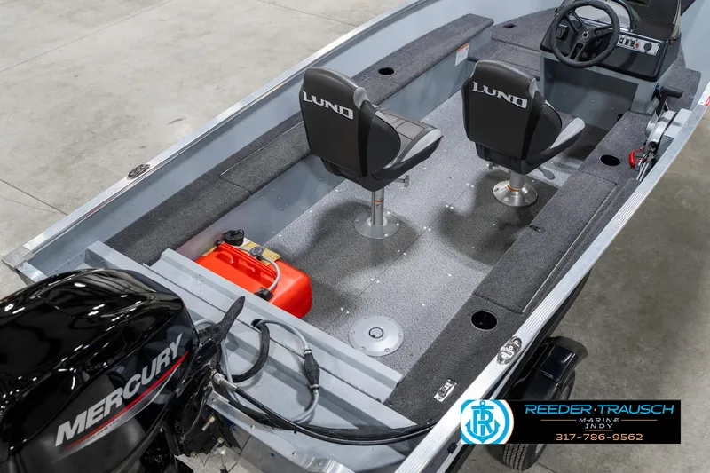 Slide: The Image of 2025 Lund 1600 Fury boat interior with Mercury engine and dual seats. - 12
