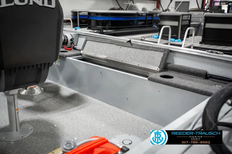 Slide: The Image of 2025 Lund 1600 Fury boat interior with seating and storage compartments. - 23
