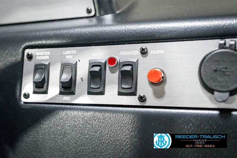 Slide: The Image of Control panel of 2025 Lund 1600 Fury boat with switches and buttons. - 30