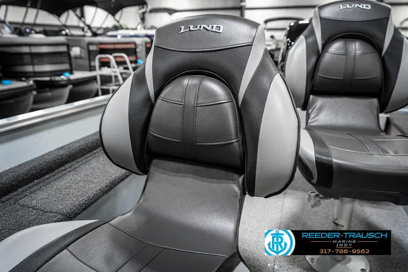 Slide: The Image of 2025 Lund 1600 Fury boat seats, black and gray design, Reeder-Trausch Marine logo visible. - 32