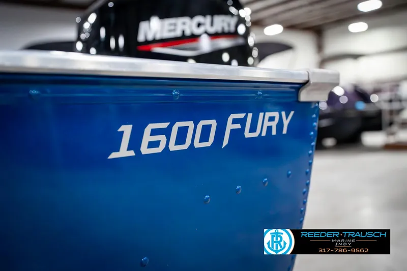 Slide: The Image of 2025 Lund 1600 Fury boat with Mercury engine in showroom. - 42
