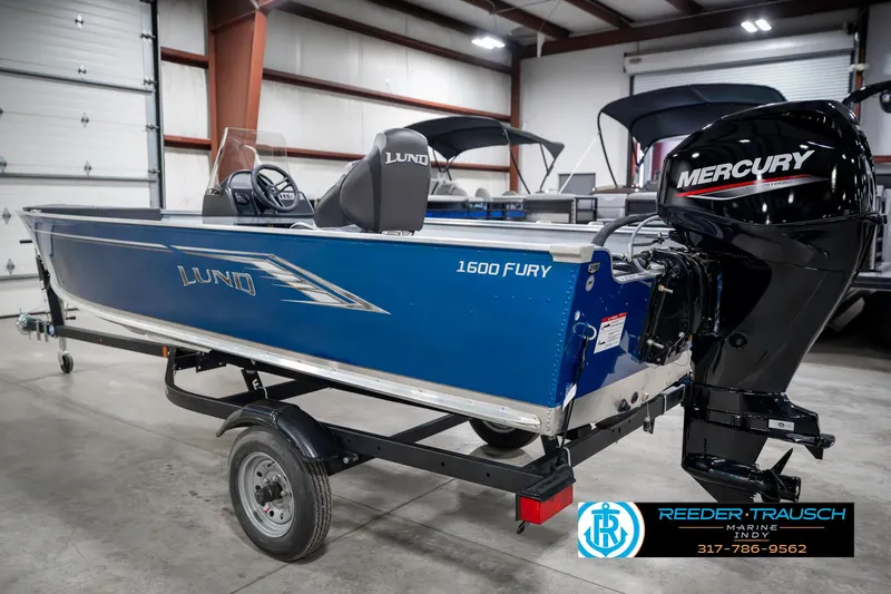 Slide: The Image of 2025 Lund 1600 Fury boat with Mercury engine on trailer in showroom. - 8