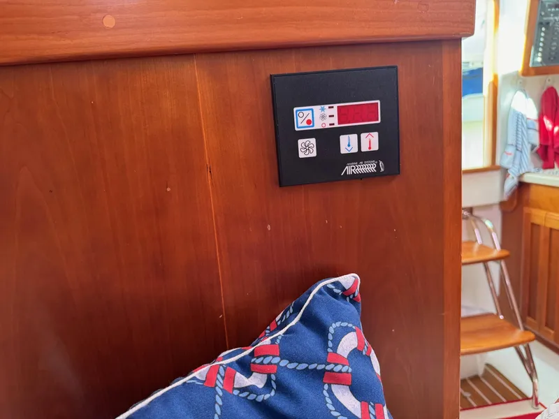 Slide: The Image of Control panel on 2007 Back Cove 29 boat interior with nautical-themed cushion. - 15