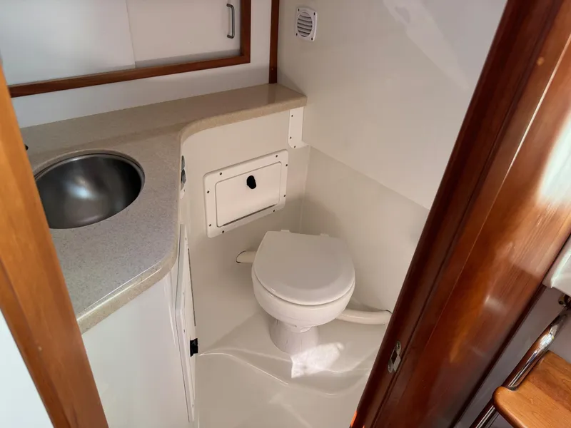 Slide: The Image of 2007 Back Cove 29 boat bathroom with sink and toilet. - 16