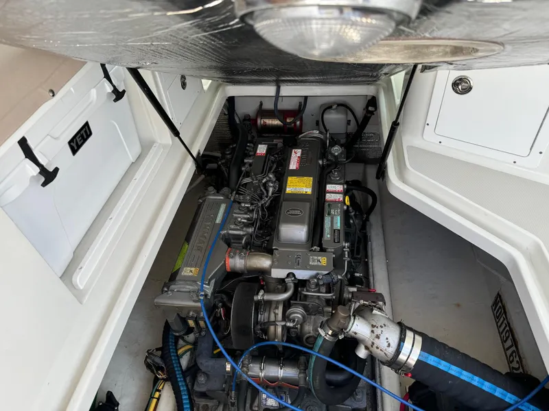 Slide: The Image of Engine compartment of a 2007 Back Cove 29 boat, showcasing detailed machinery. - 17