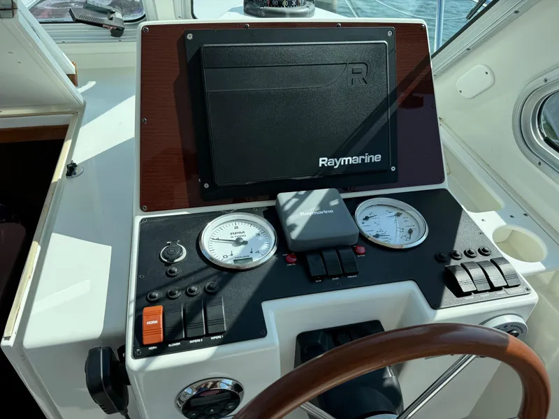 Slide: The Image of 2007 Back Cove 29 helm with Raymarine navigation system and gauges. - 5