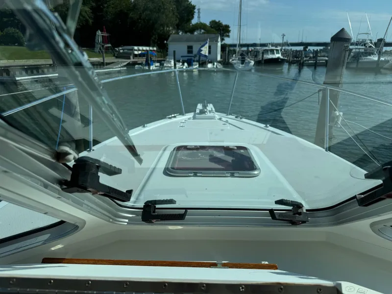Slide: The Image of 2007 Back Cove 29 boat docked at a marina, view from the cabin. - 7