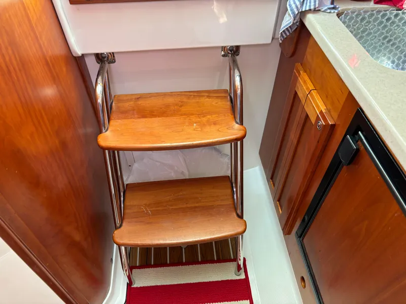 Slide: The Image of Wooden steps with metal rails in a 2007 Back Cove 29 boat interior. - 8