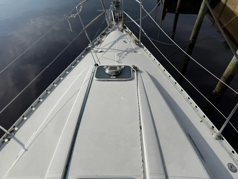 Slide: The Image of Deck view of a 1998 Beneteau Oceanis 352 sailboat, showing sleek design and rigging. - 3