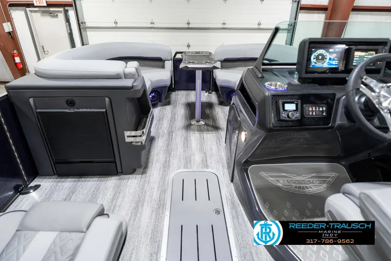 Slide: The Image of 2025 Bennington 22 MSB boat interior with modern dashboard and seating. - 19