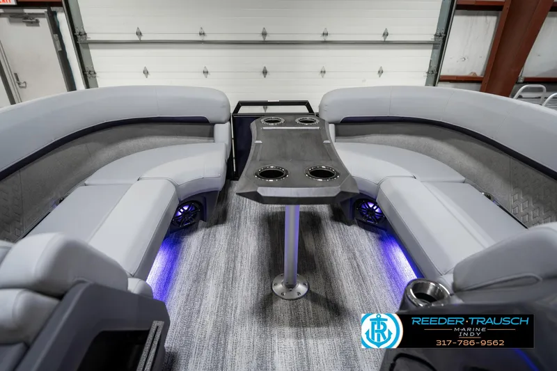 Slide: The Image of 2025 Bennington 22 MSB boat interior with gray seating and ambient lighting. - 20