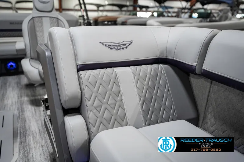 Slide: The Image of 2025 Bennington 22 MSB boat interior with luxurious gray seating and detailed stitching. - 23