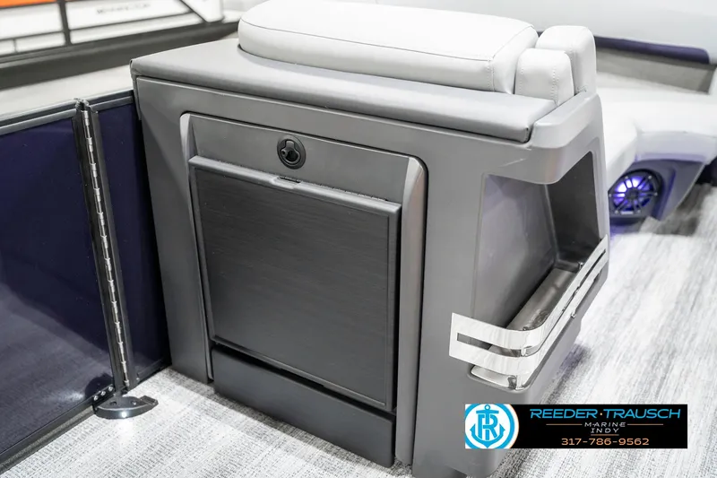 Slide: The Image of 2025 Bennington 22 MSB boat interior with sleek seating and storage compartment. - 25