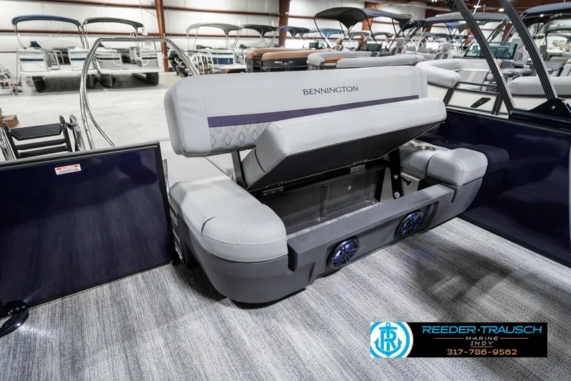Slide: The Image of 2025 Bennington 22 MSB pontoon boat with adjustable seating in showroom. - 28