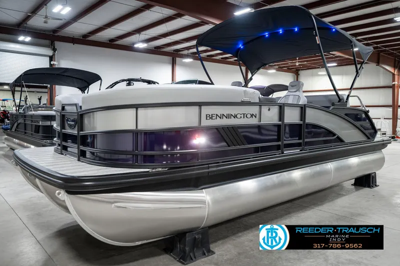 Slide: The Image of 2025 Bennington 22 MSB pontoon boat in showroom with canopy and LED lights. - 3