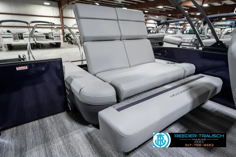 Slide: The Image of 2025 Bennington 22 MSB boat interior with luxurious gray seating in showroom. - 32
