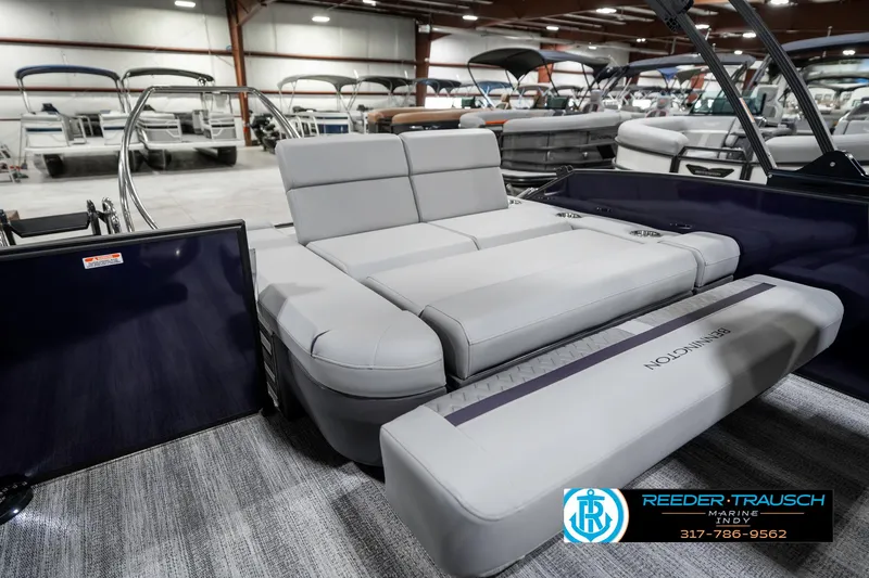 Slide: The Image of 2025 Bennington 22 MSB pontoon boat interior with luxurious seating in showroom. - 33