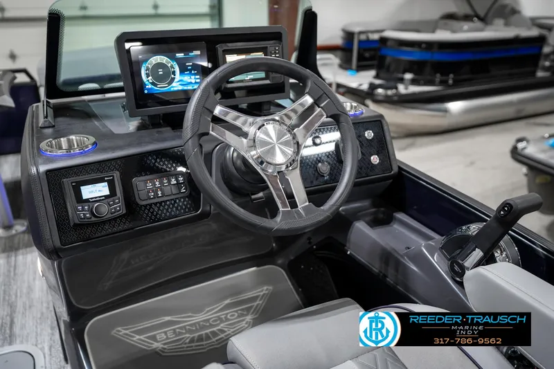 Slide: The Image of 2025 Bennington 22 MSB boat dashboard with modern controls and steering wheel. - 38