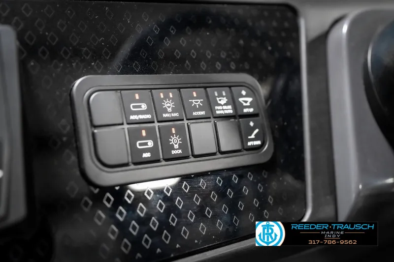 Slide: The Image of Dashboard control panel of 2025 Bennington 22 MSB boat with various function buttons. - 41