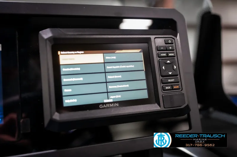 Slide: The Image of Garmin display on 2025 Bennington 22 MSB boat dashboard, featuring navigation controls. - 43