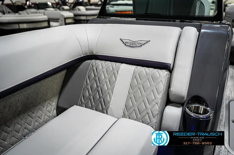 Slide: The Image of 2025 Bennington 22 MSB boat interior with luxurious quilted seating and cup holder. - 47