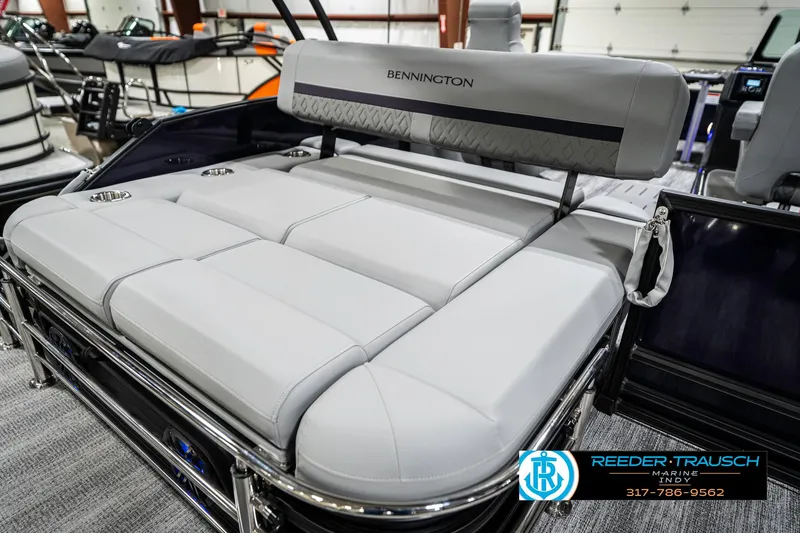 Slide: The Image of 2025 Bennington 22 MSB boat with luxurious seating in showroom. - 48