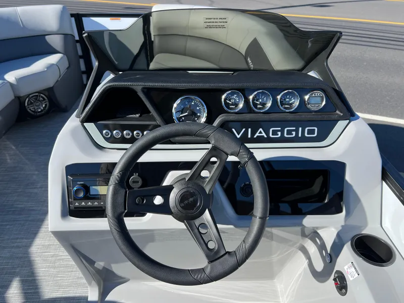Slide: The Image of 2025 Viaggio Lago V20U boat dashboard with steering wheel and gauges. - 17