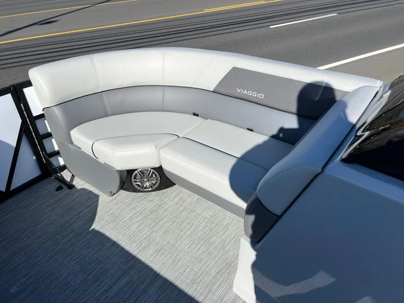 Slide: The Image of 2025 Viaggio Lago V20U boat with sleek gray seating on a sunny day. - 22