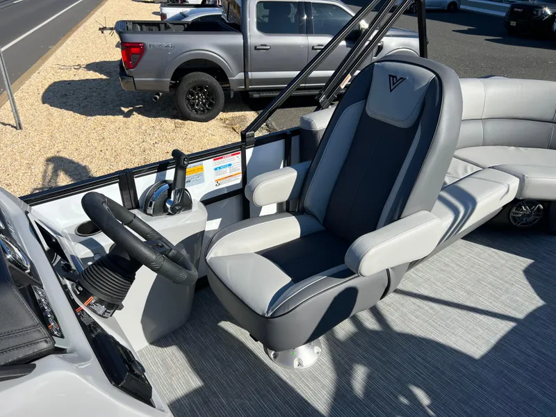 Slide: The Image of Captain's seat on 2025 Viaggio Lago V20U boat, featuring modern design and controls. - 26