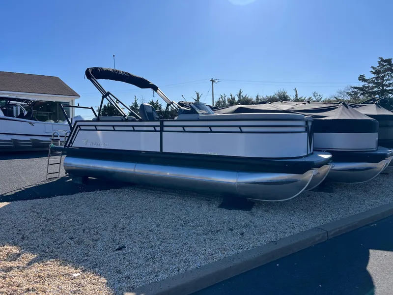 Slide: The Image of 2025 Viaggio Lago V20U pontoon boat displayed outdoors on gravel. - 3
