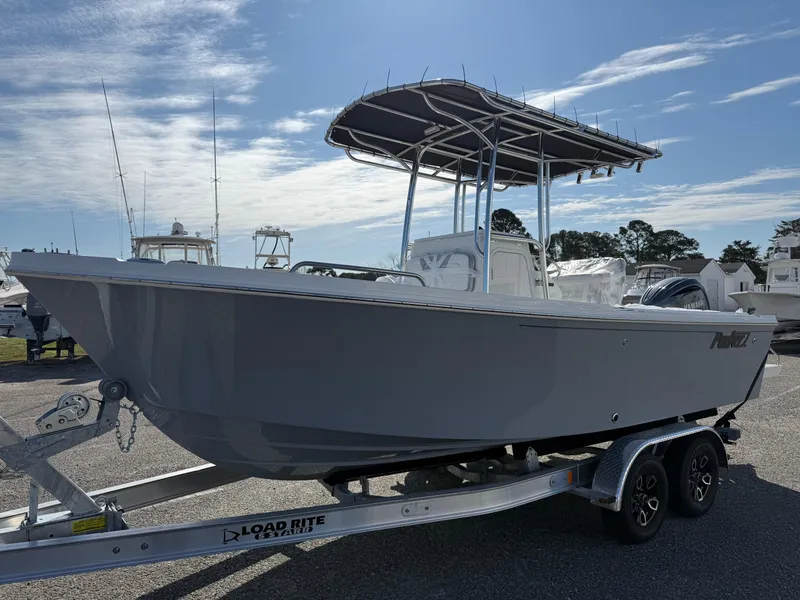 The Image of 2025 Parker 21SE boat on Load Rite trailer under clear sky. - 0