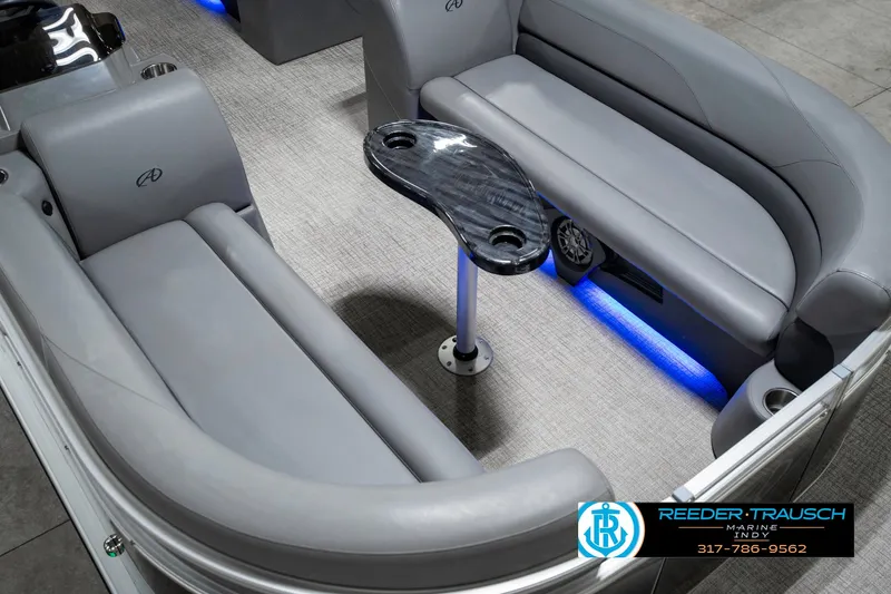 Slide: The Image of 2023 Avalon 2380 VLS boat interior with gray seating and blue LED lighting. - 13