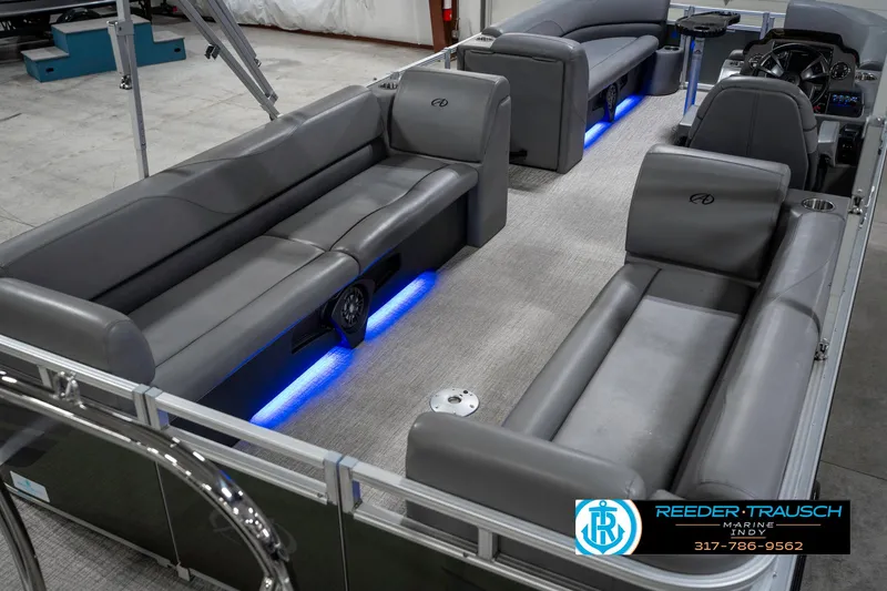 Slide: The Image of 2023 Avalon 2380 VLS pontoon boat interior with gray seating and blue LED lighting. - 14