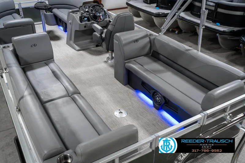 Slide: The Image of 2023 Avalon 2380 VLS pontoon boat interior with gray seating and blue LED lighting. - 15
