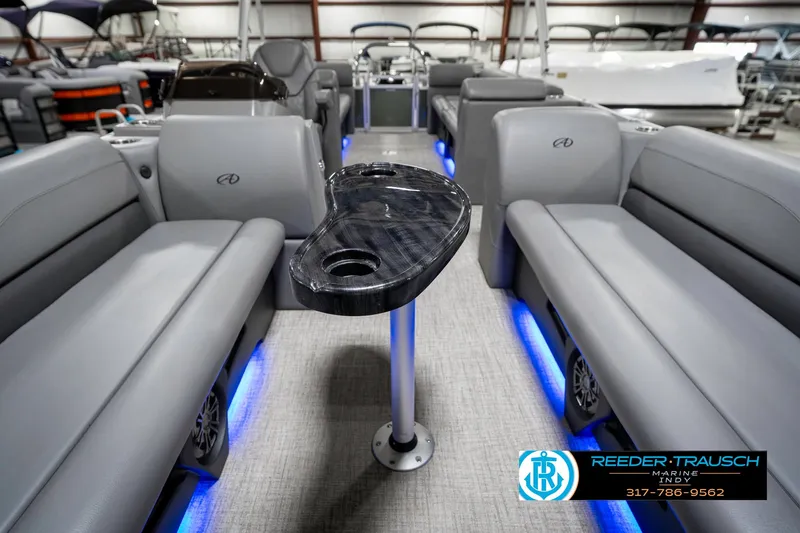 Slide: The Image of 2023 Avalon 2380 VLS pontoon boat interior with gray seating and blue LED lighting. - 16