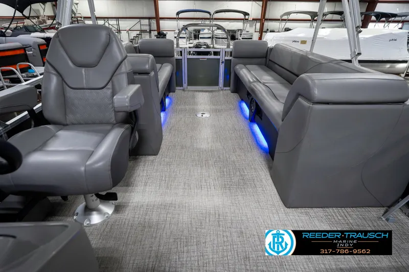 Slide: The Image of 2023 Avalon 2380 VLS pontoon boat interior with gray seating and blue LED lighting. - 17