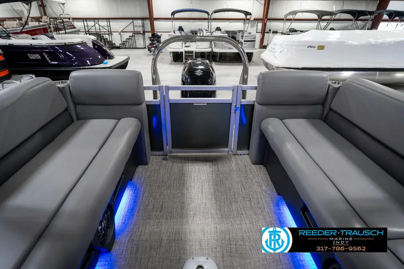 Slide: The Image of 2023 Avalon 2380 VLS pontoon boat interior with gray seating and blue LED lighting. - 18