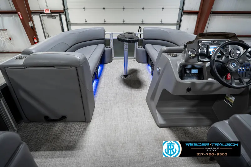 Slide: The Image of 2023 Avalon 2380 VLS boat interior with gray seating and illuminated blue accents. - 20