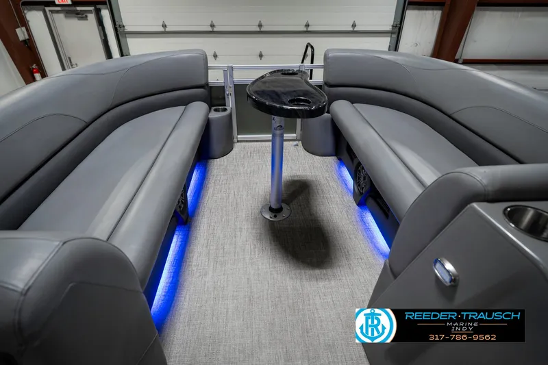 Slide: The Image of 2023 Avalon 2380 VLS boat interior with gray seating and blue LED lighting. - 21