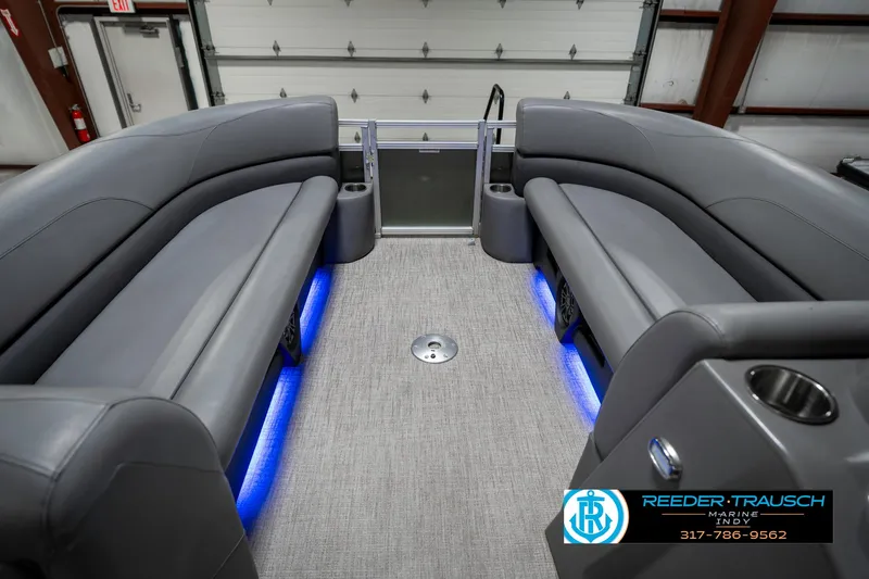 Slide: The Image of 2023 Avalon 2380 VLS interior with gray seating and blue LED lighting. - 22