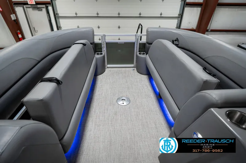 Slide: The Image of 2023 Avalon 2380 VLS boat interior with gray seating and blue LED lighting. - 23