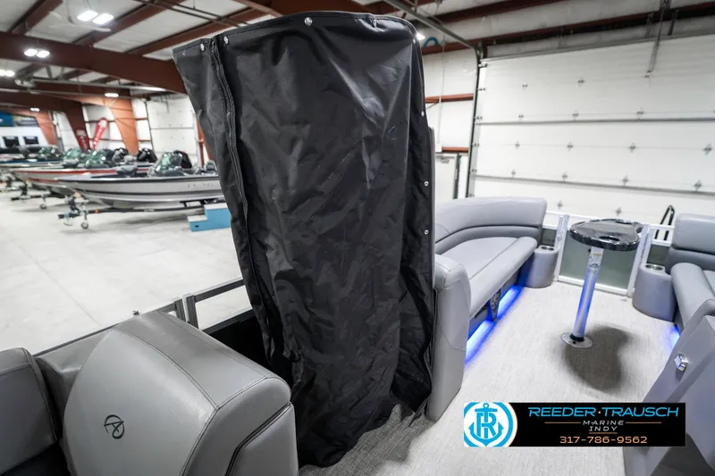 Slide: The Image of 2023 Avalon 2380 VLS pontoon boat interior with seating and storage cover. - 31