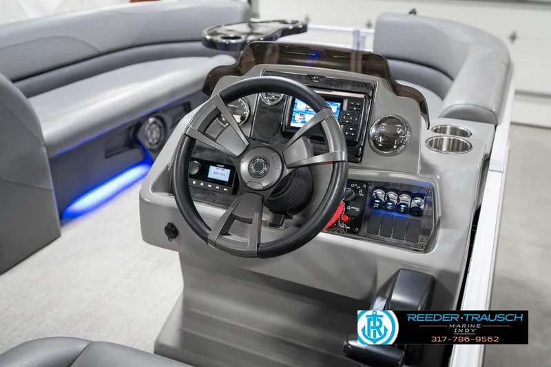 Slide: The Image of 2023 Avalon 2380 VLS boat dashboard with steering wheel and control panel. - 33